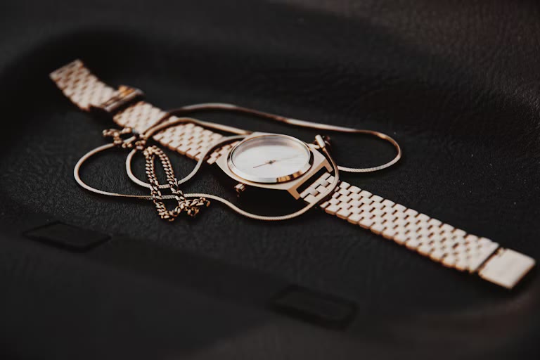 silver and gold round analog watch